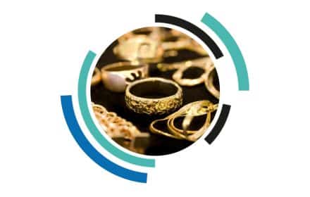 Gold jewellery including necklaces and rings, highlighting items typically stored in high-security jewellery safes